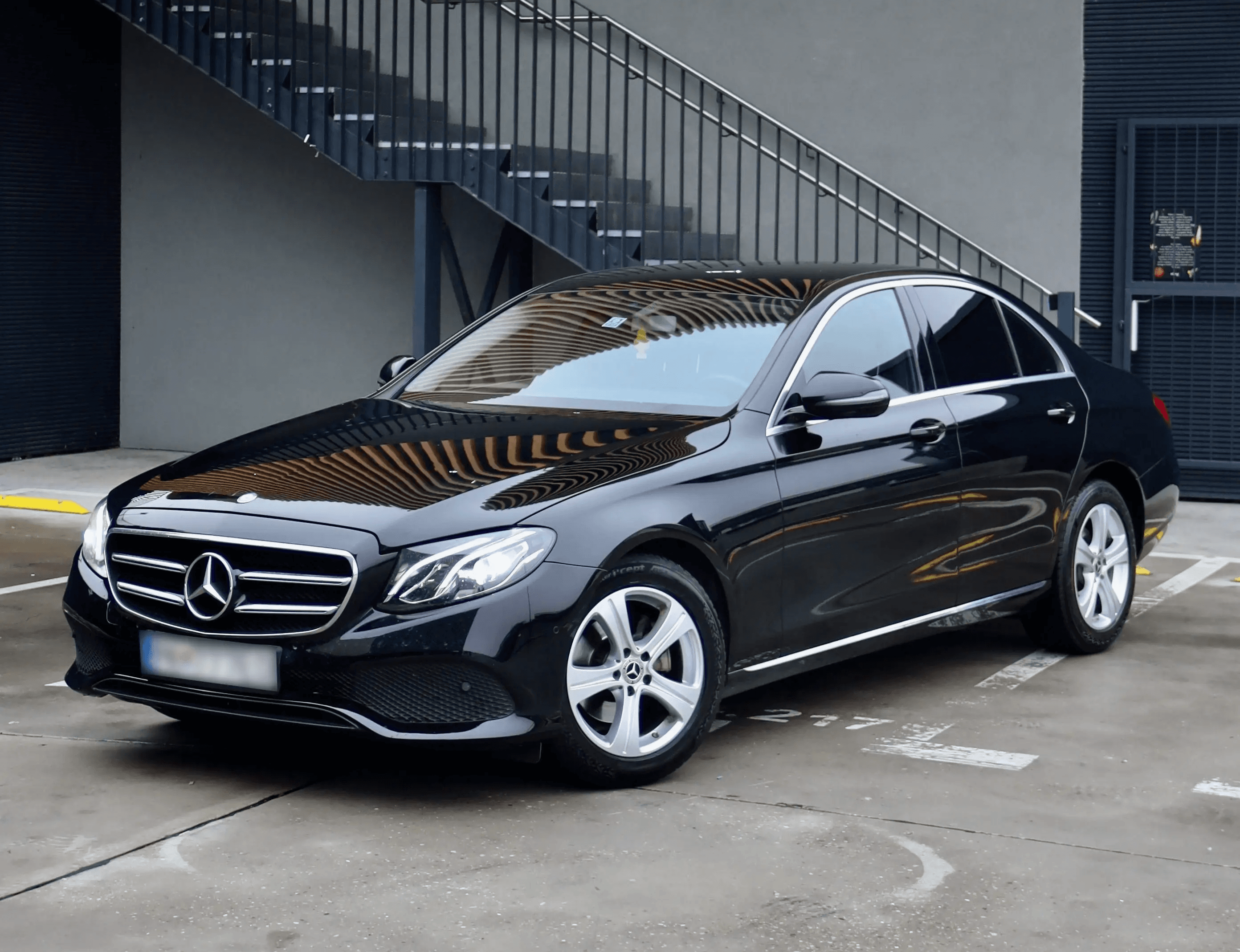 Mercedes E-Class in modern parking